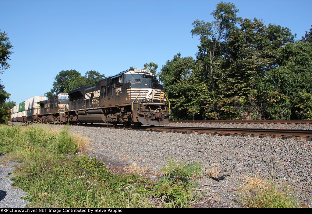 NS 1059 takes a train down the siding